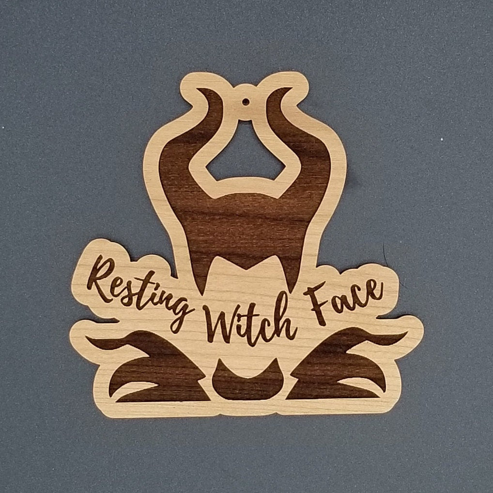 Resting witch face ornament