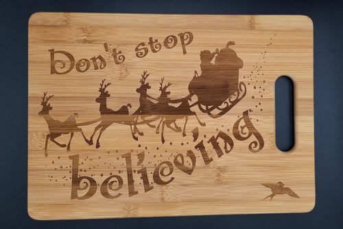 Don't stop believing santa bamboo cutting board