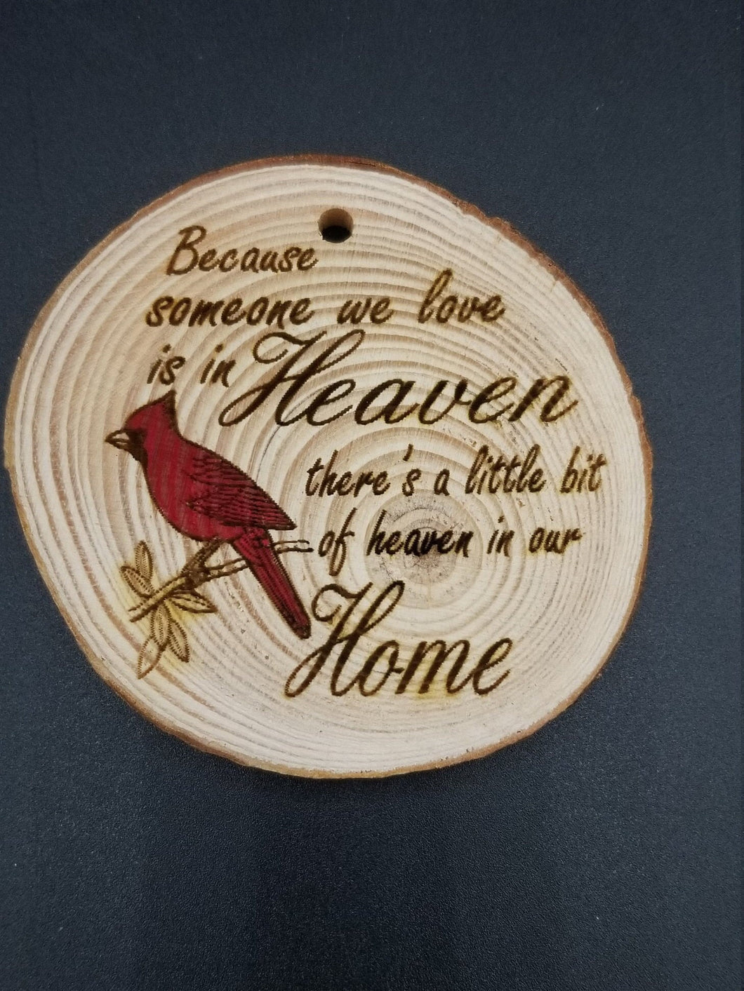 Because someone we love is in heaven theres a little bit of heaven in our home cardinal tree slice ornament