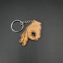 Load image into Gallery viewer, Circle game hand wood keychain - Altered Goods
