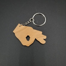 Load image into Gallery viewer, Circle game hand wood keychain - Altered Goods
