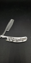 Load image into Gallery viewer, Hooligan shamrock brass knuckle metal folding beard comb and bottle open - Altered Goods
