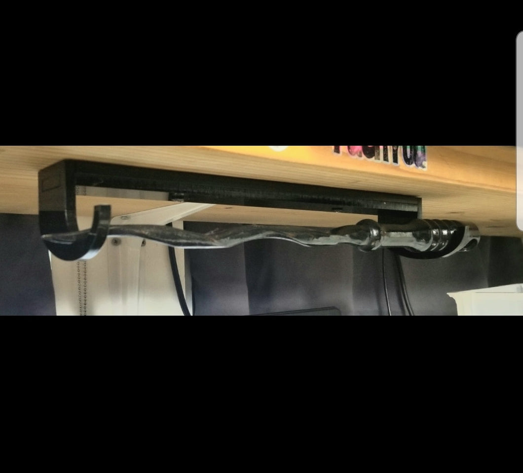 Under shelf wand holder